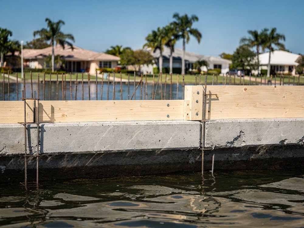 Marine contractor repairing a seawall cap in Miami, FL